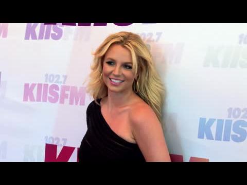 VIDEO : Britney Spears Auctioning Femme Fatale Items For Charity