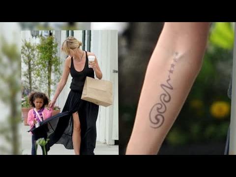 VIDEO : Heidi Klum Removing Her Seal Tattoo
