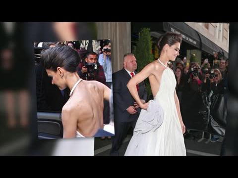 VIDEO : Katie Holmes Shows Off Her Bony Frame In Odd Backless Dress At Met Ball