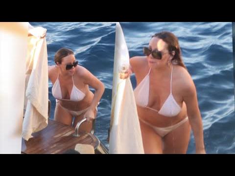 VIDEO : Mariah Carey Shows Off Her Curves In A Barely-There White Bikini