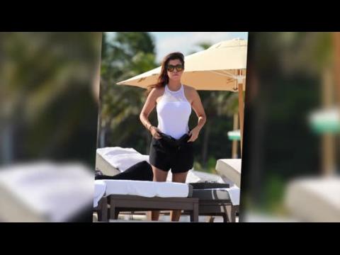 VIDEO : Kourtney Kardashian Looks White Hot in a Sheer Panelled Swimsuit