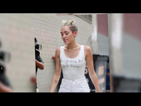 VIDEO : Miley Cyrus Looks All White As She Rocks Pig Tails In The Rain