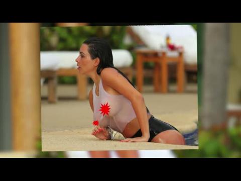 VIDEO : Kim Kardashian Relaxes Poolside in a See-Through Crop Top
