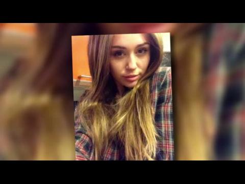 VIDEO : Miley Cyrus Sports a Long Brown Wig For Halloween