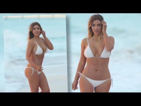 VIDEO : Kim Kardashian Hits The Beach in White Bikini