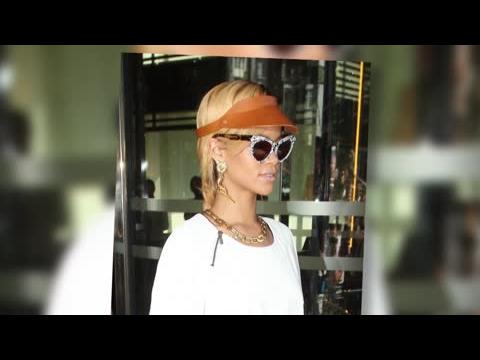VIDEO : Rihanna Is A Bangin' Babe As She Wears Gun Earrings