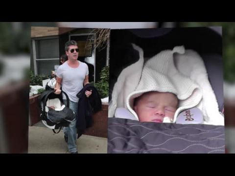 VIDEO : Simon Cowell Has A Little Trouble Loading Son's Car Seat