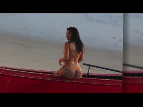 VIDEO : Kim Kardashian Sizzles In Thong Bikini Photo Shoot